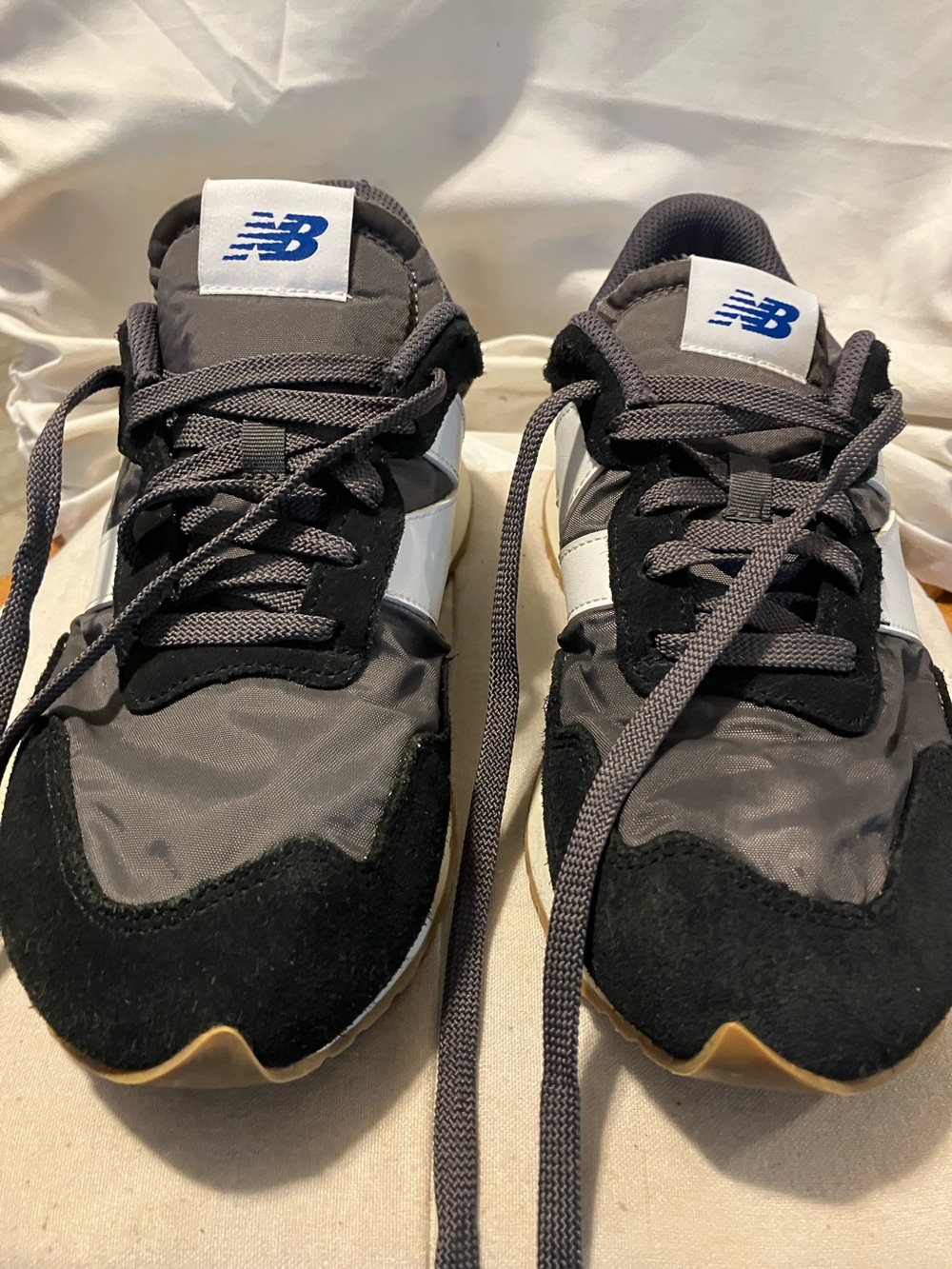 Used , but in great condition New Balance. Men’s 8.5. Women’s 9.5. Black ,grey